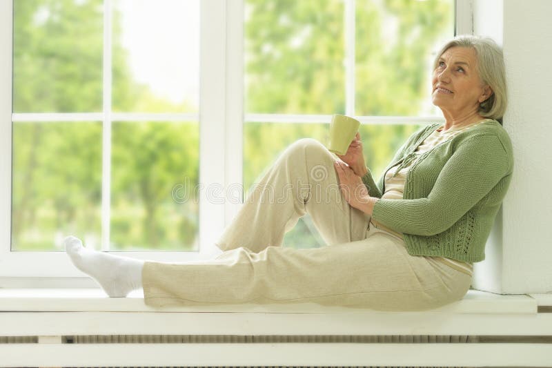 Senior woman portrait with cup of tea