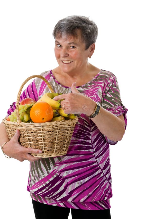 Senior woman presenting fruit