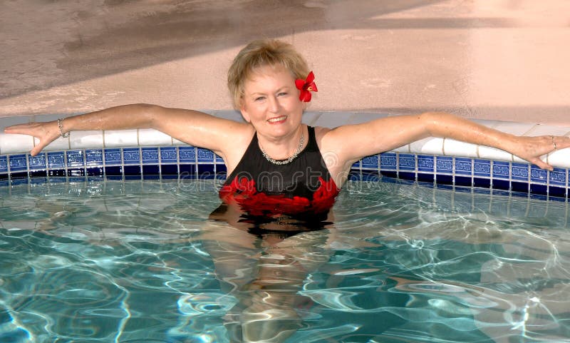 Senior woman relaxing in the pool