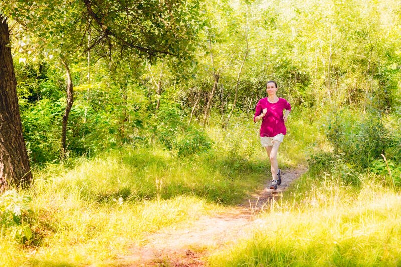 Senior Woman Running in the Forest Stock Image - Image of jogging ...