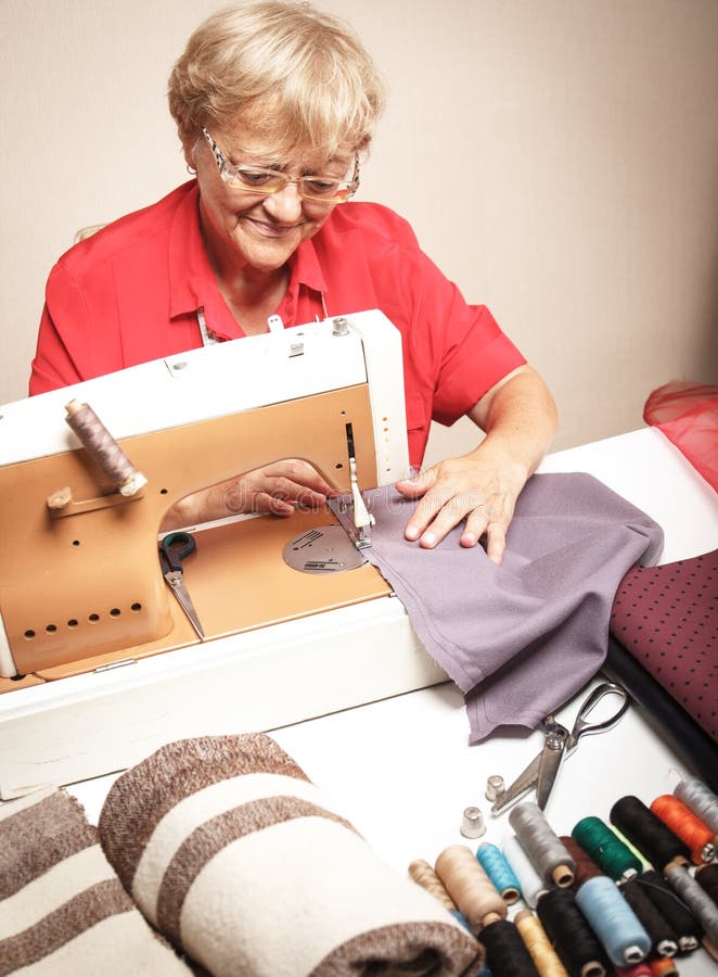 Senior Woman Sewing on a Sewing Machine Stock Image Image of indoors, machine 53355121