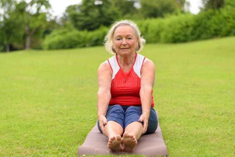 Senior Woman Sitting on Yoga Mat Stock Image - Image of older, yoga ...