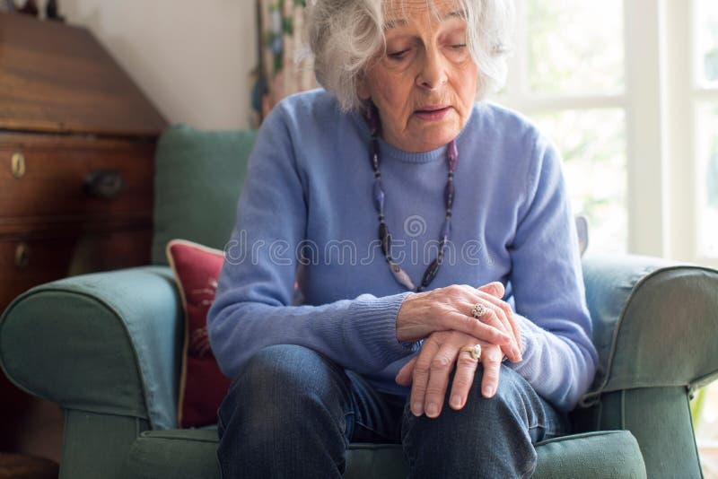 Senior Woman Suffering With Parkinsons Diesease stock photo Senior Woman Suffering With Parkinsons Diesease stock photo