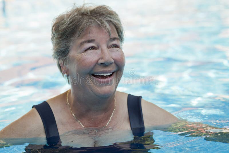 Senior woman swimming at the pool