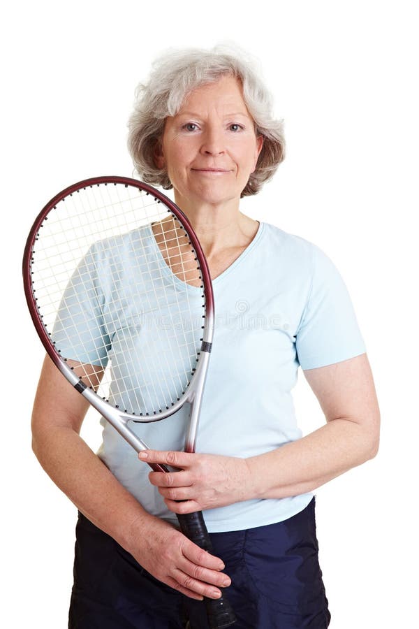 Smiling elderly woman holding a tennis racket. Smiling elderly woman holding a tennis racket