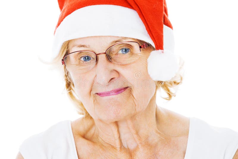 Senior Woman Wearing Santa Hat Over White Background royalty free stock photography Senior Woman Wearing Santa Hat Over White Background royalty free stock photography
