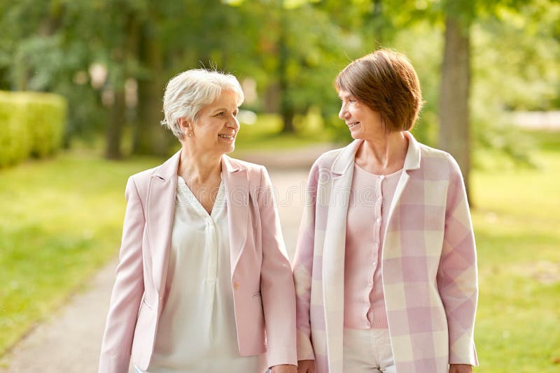 Senior Women or Friends Walking Along Summer Park Stock Photo - Image ...