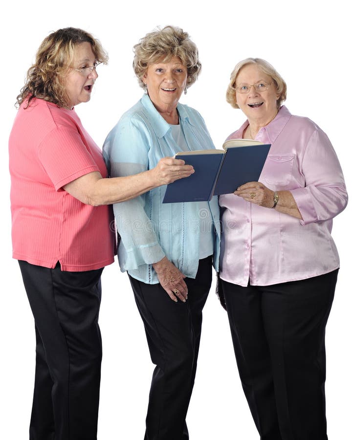 Three senior women singing together from a songbook. On a white background.