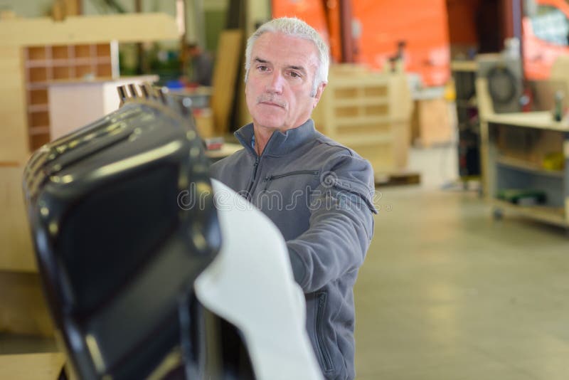 Senior worker blue collar worker stock photos