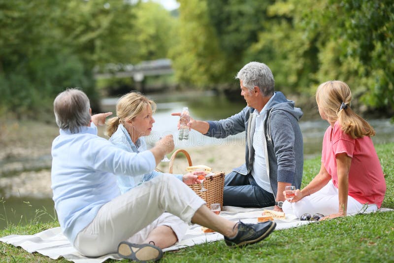 Seniors having a pic-nic outdoors stock images Seniors having a pic-nic outdoors stock images