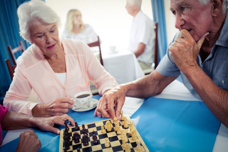 Seniors playing chess stock photo. Image of concept, elderly 74053562