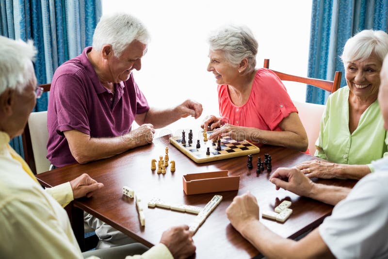 Seniors playing games. In a retirement home royalty free stock photography