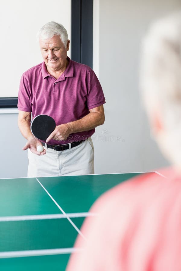 Seniors playing pingpong stock image. Image of activity 77686691