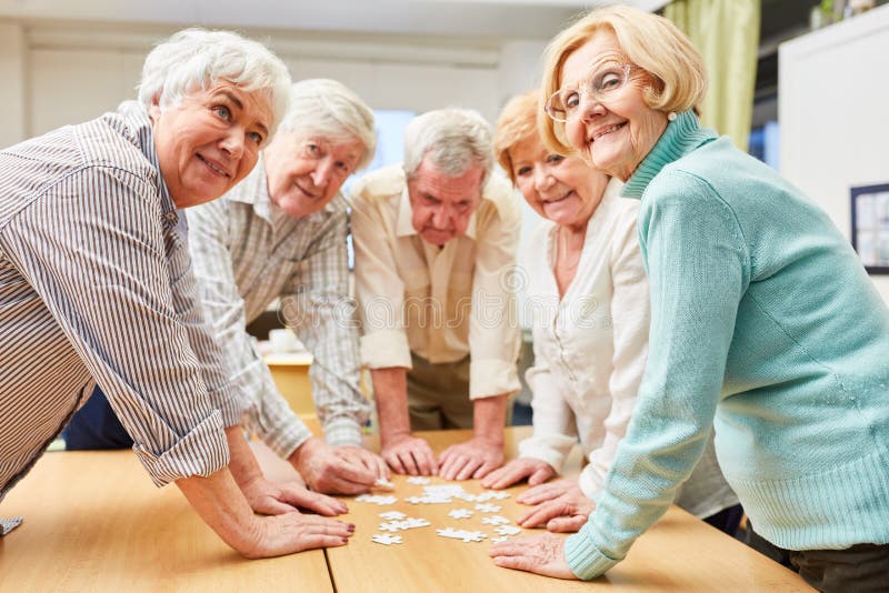 Seniors Playing the Puzzle As Memory Training Stock Image Image of