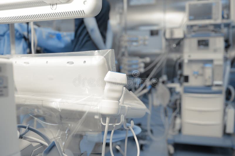 Sensor of the ultrasonic device in the medical room filled with stock images Sensor of the ultrasonic device in the medical room filled with stock images