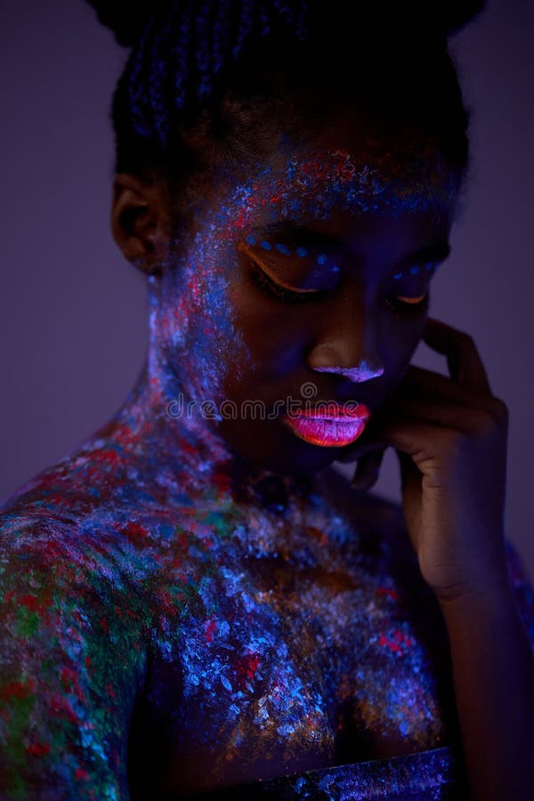 Sensual Woman with Black Skin in Fluorescent Paint Makeup, Posing at Camera  Stock Photo - Image of foreigner, colored: 236587132