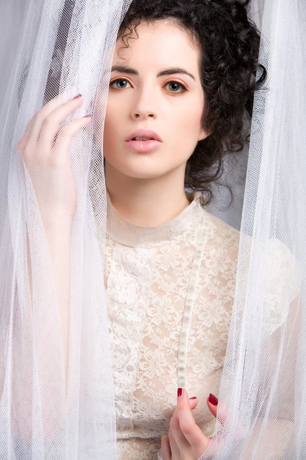 Sensual brunette model in lace blouse