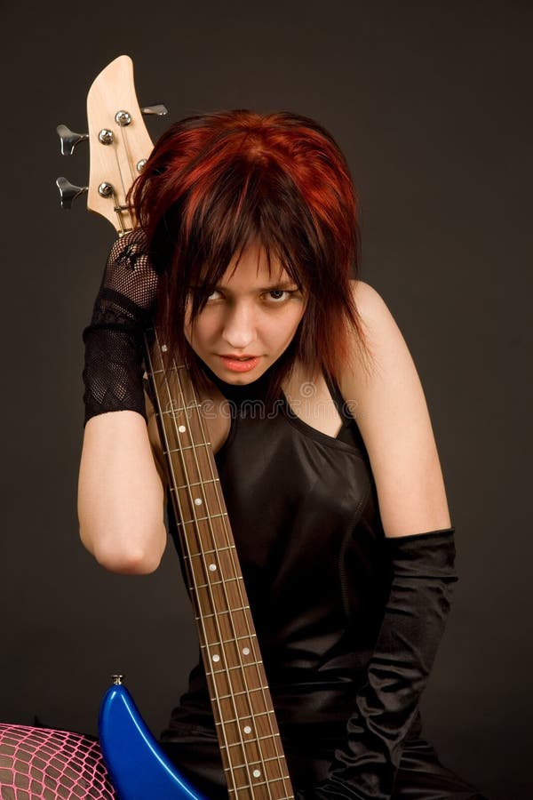 Sensual girl with bass guitar