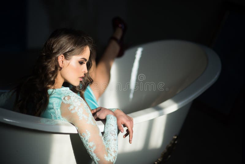 Sensual girl in bathtub. sensual girl has fashion makeup and relax in bathroom. beautiful. royalty free stock photography Sensual girl in bathtub. sensual girl has fashion makeup and relax in bathroom. beautiful. royalty free stock photography