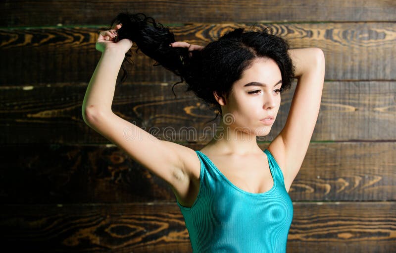 Sensual girl with curly hair. Sport. sexy woman in fitness bodysuit. erotic games. Spa salon. woman with perfect body stock photo Sensual girl with curly hair. Sport. sexy woman in fitness bodysuit. erotic games. Spa salon. woman with perfect body stock photo