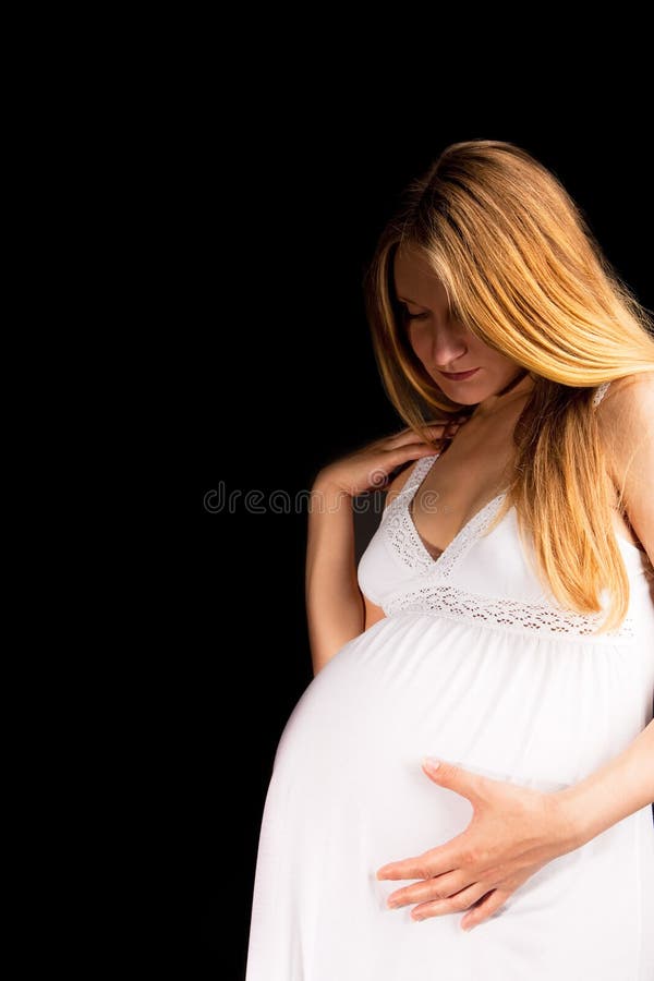 Sensual pregnant blonde woman