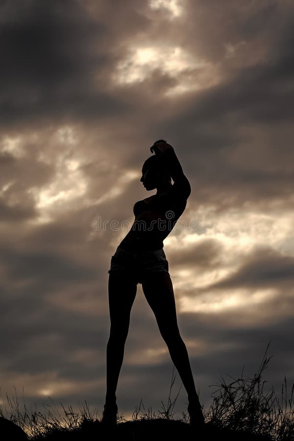 Sensual woman. Female silhouette on sky backdrop royalty free stock images Sensual woman. Female silhouette on sky backdrop royalty free stock images