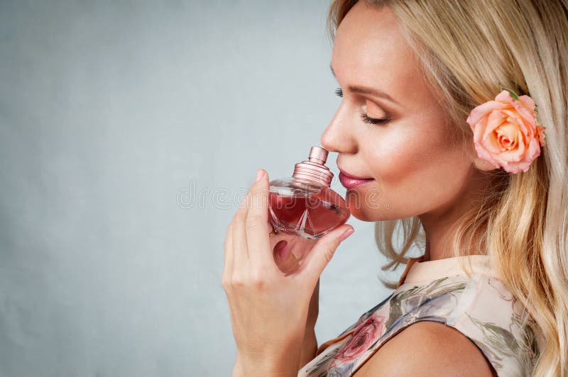 Sensual tender delicate young woman portrait with fragrance, enjoyment concept on vintage background