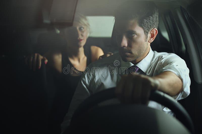 Sensual woman and driver on a car royalty free stock image Sensual woman and driver on a car royalty free stock image