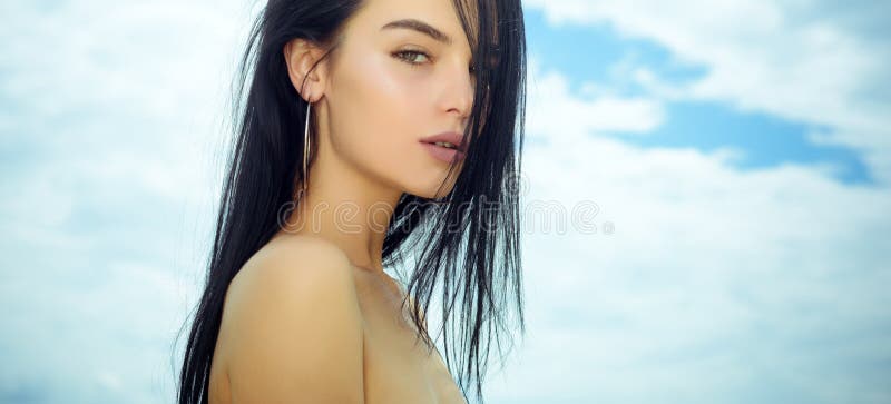 Sensual woman with young face skin, naked shoulders, beauty