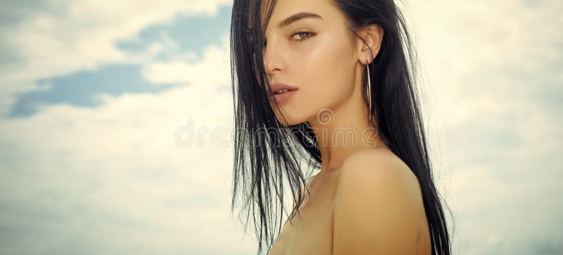 Sensual woman with young face skin, naked shoulders, beauty