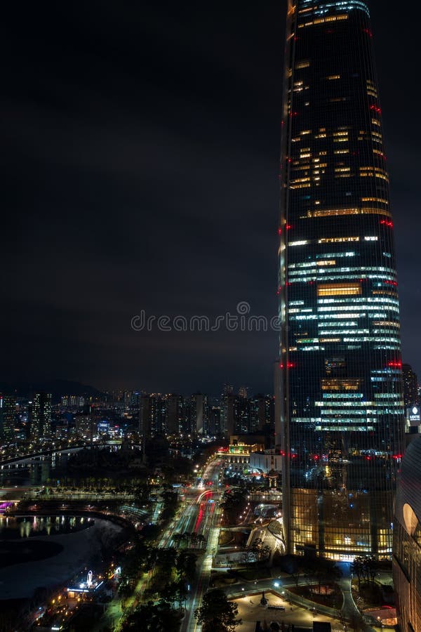 Jamsil buildings and Seokchon lake at night, Jamsil, Songpa-gu, Seoul, South Korea. Vertical view stock photos Jamsil buildings and Seokchon lake at night, Jamsil, Songpa-gu, Seoul, South Korea. Vertical view stock photos