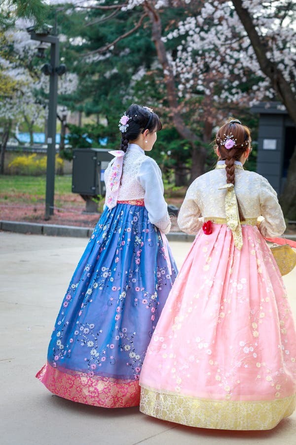 Asian Korean woman dressed Hanbok in traditional dress walking in Gyeongbokgung Palace