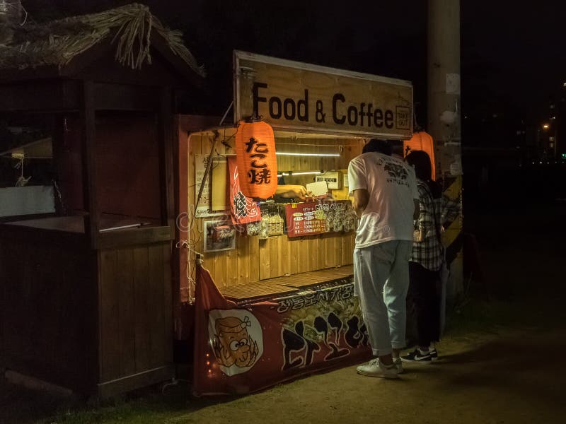 Seoul, South Korea - June 13, 2017: Couple Buying Food in Food Truck