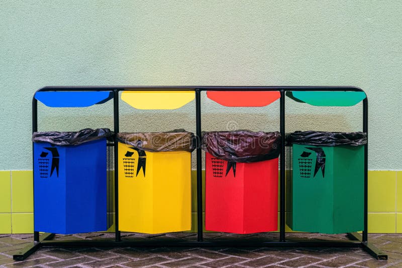 Separate Collection of Glass, Metal, Paper and Plastic. Colored Bins