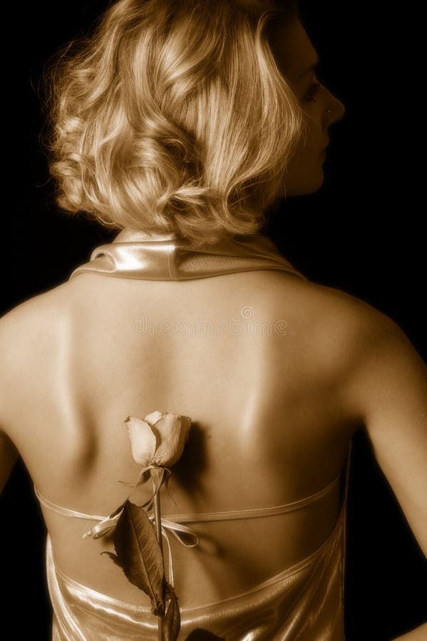 Sepia picture of a girl with a rose