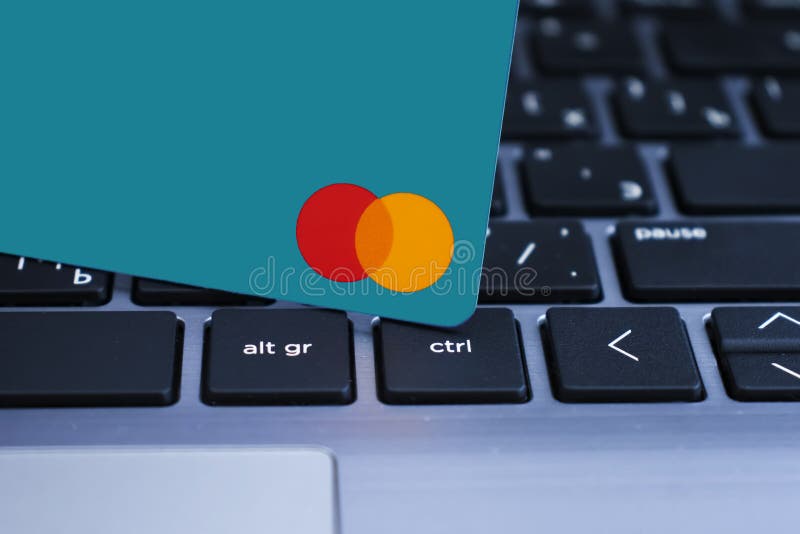 September 1, 2021, Ukraine, Kiev plastic card of payment system Mastercard laptop electronic business debit concept. September 1, 2021, Ukraine, Kiev plastic card of payment system Mastercard laptop electronic business debit concept