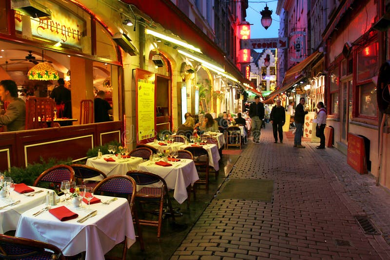 Restaurants, bars and coffee shops on old streets of evening Brussels, Belgium. Restaurants, bars and coffee shops on old streets of evening Brussels, Belgium.