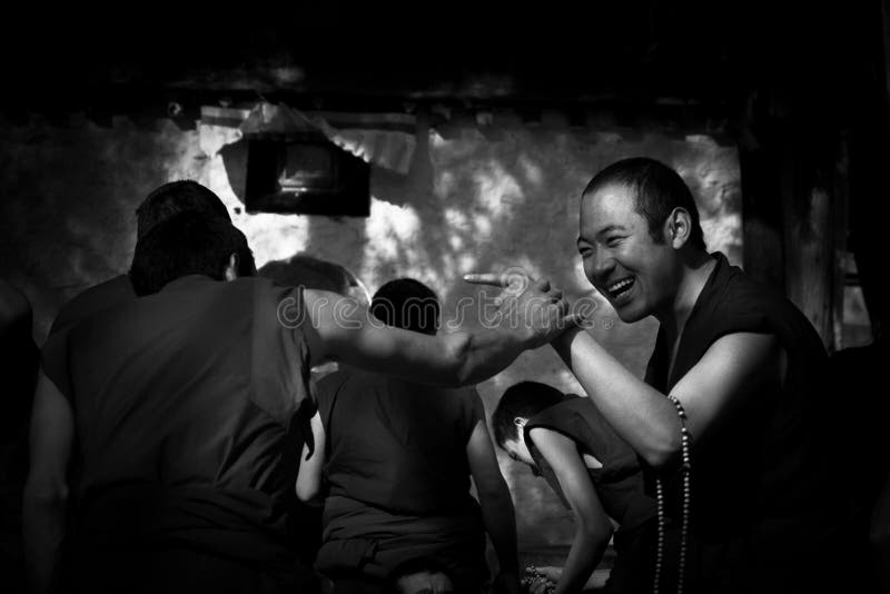 Sera Monastery Debating Monks pointing in fun Lhasa Tibet