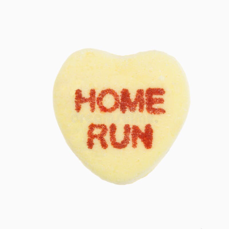 Yellow candy heart that reads home run against white background. Yellow candy heart that reads home run against white background.