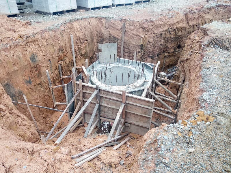 Utility services manhole under construction at the construction site. stock photo