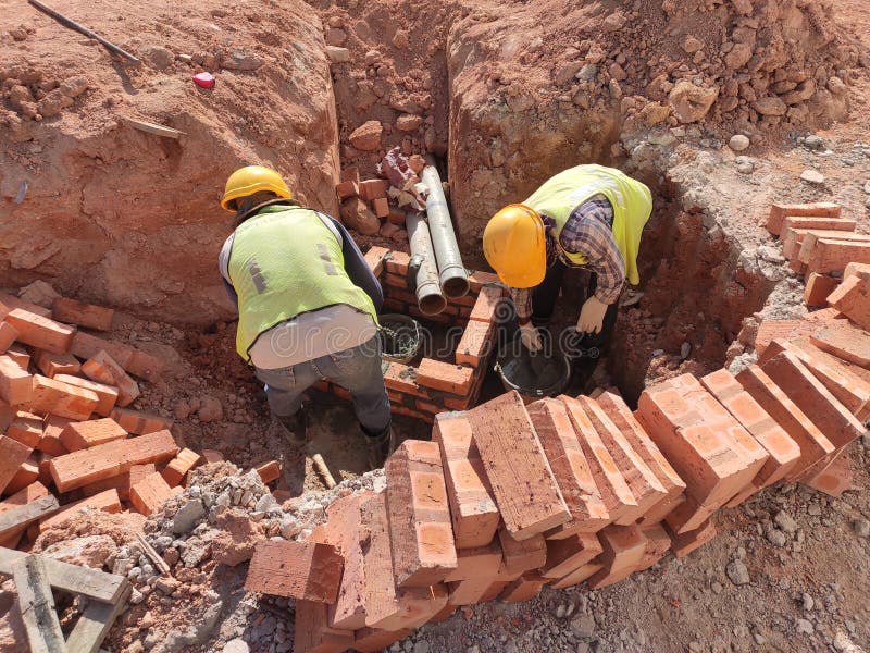 Utility services manhole under construction at the construction site. royalty free stock photography