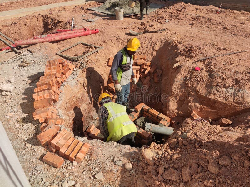 Utility services manhole under construction at the construction site. royalty free stock images