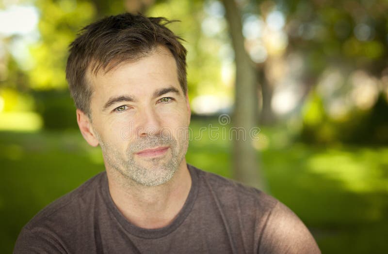 Serene Handsome Man Looking At The Camera stock photography Serene Handsome Man Looking At The Camera stock photography