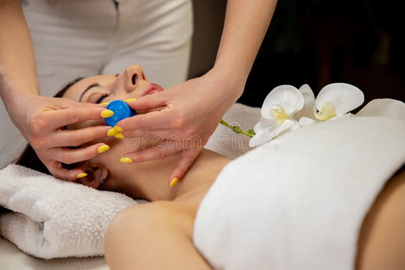 A serene and peaceful spa facial treatment, showcasing rejuvenating techniques that promote tranquility and wellbeing. Pampering experience stock images, royalty-free photos and pictures
