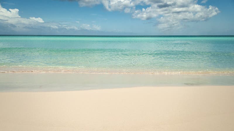 Serenity, calming vacation and serene oceans concept with 16:9 crop of wide angle photograph of empty beach background with copy