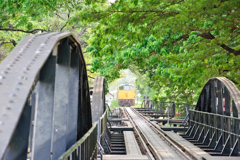 Yellow train coming to River Kwai Bridge , Kanchanaburi,Thailand. Yellow train coming to River Kwai Bridge , Kanchanaburi,Thailand