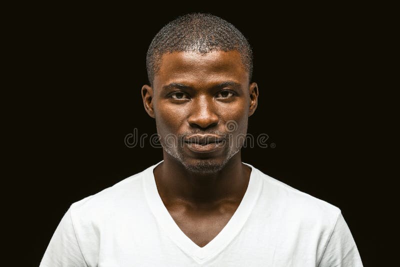 Attractive African American Man Looking Seriously at the Camera, Dark ...