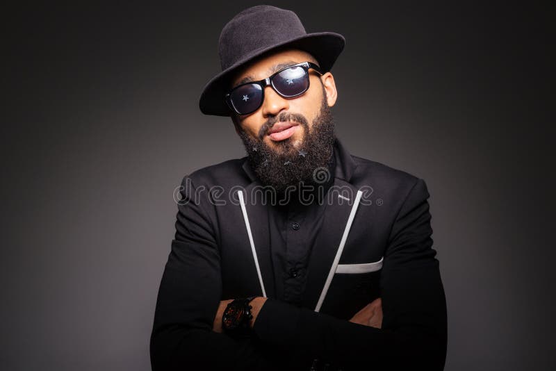 Serious afro american man in fashion cloth and glasses