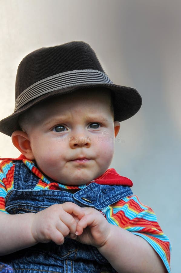Serious Baby Boy with Black Hat Stock Photo Image of skeptical
