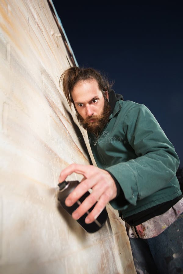 Kneeling Man Spray Painting Stock Photo Image of mural, single 32106226